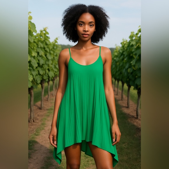Preowned green H&M pleated dress with spaghetti straps. Size 6. Fits big - Picture 1 of 7